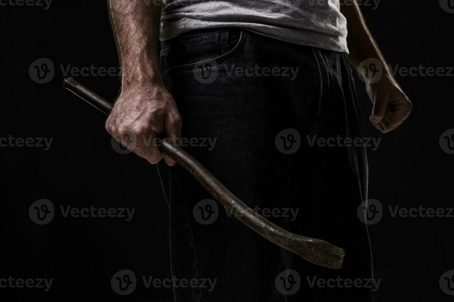 Male offender with a scrap. On black background at the studio photo