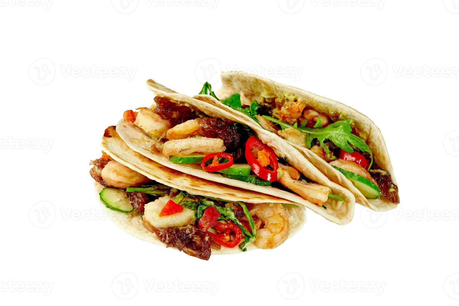Tacos with shrimps, guacamole, salsa pico de gallo, caramelized onions, cucumber, arugula and chili pepper isolated on white photo