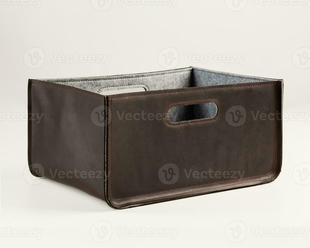 Functional stylish brown faux leather box for storage photo