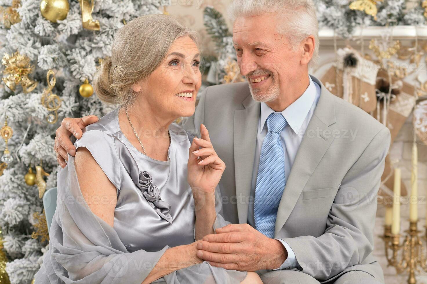 Close up portrait of old couple with Christmas present photo