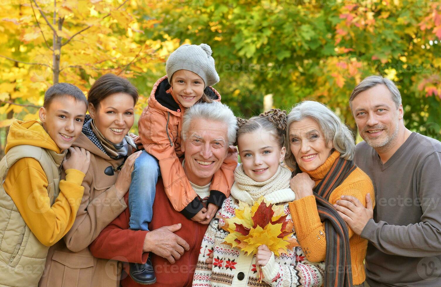 Portrait of a large family of seven in autumn photo