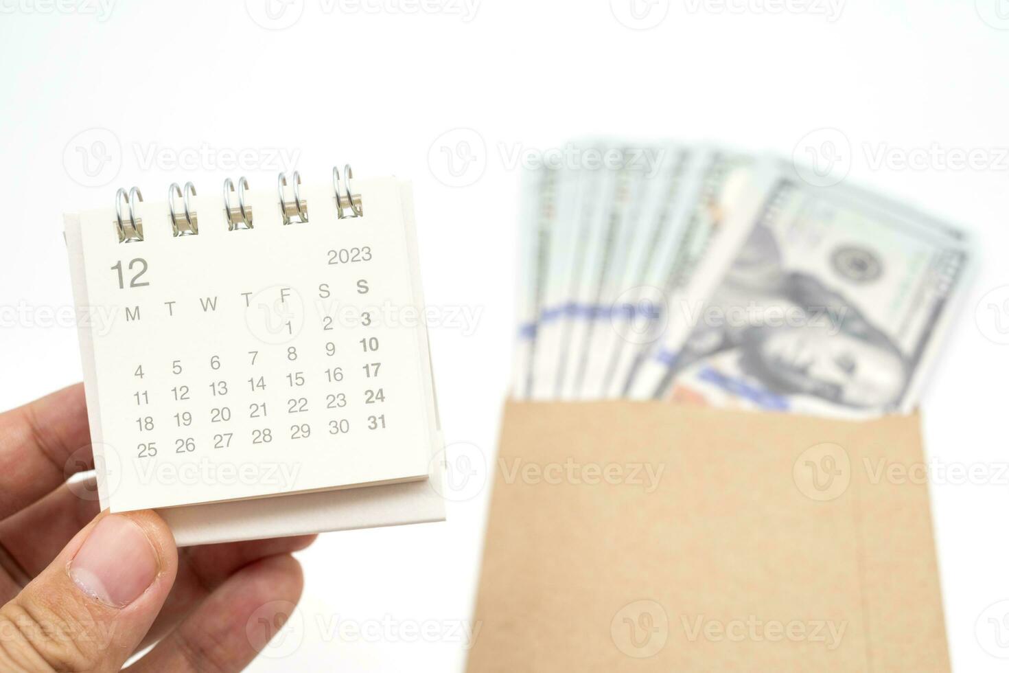 Envelope With Money And Calendar. opens envelope with money, dollars. Pension Concept. Bonus Money. isolated on white background. photo