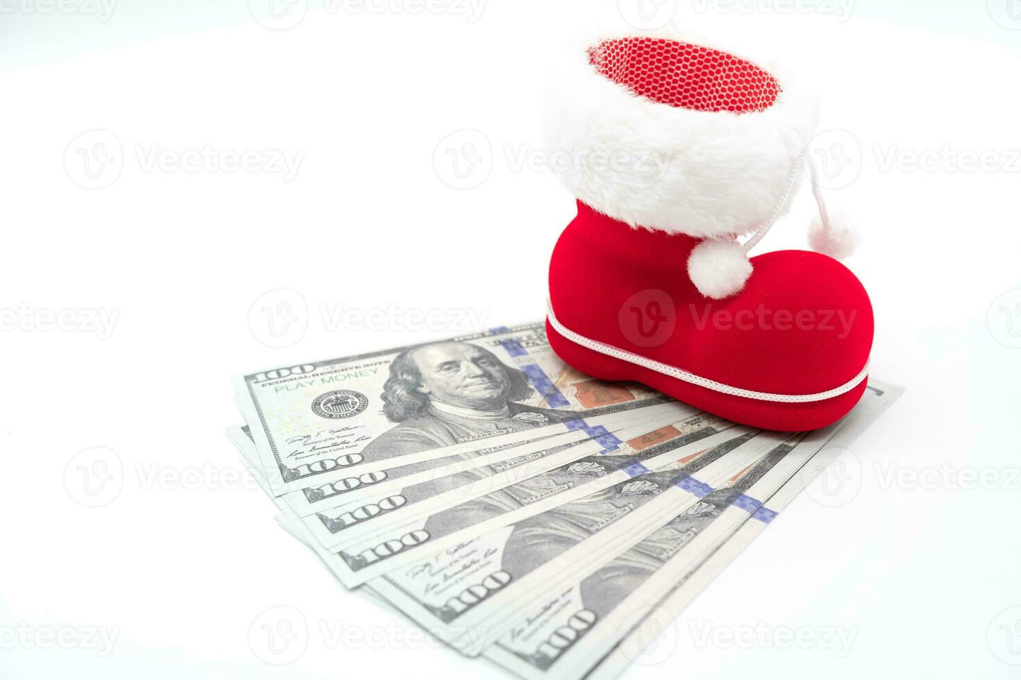 Dollars with boot of Santa Claus on white background. Merry Christmas and Happy New Year Concept. Xmas background. copy space. photo