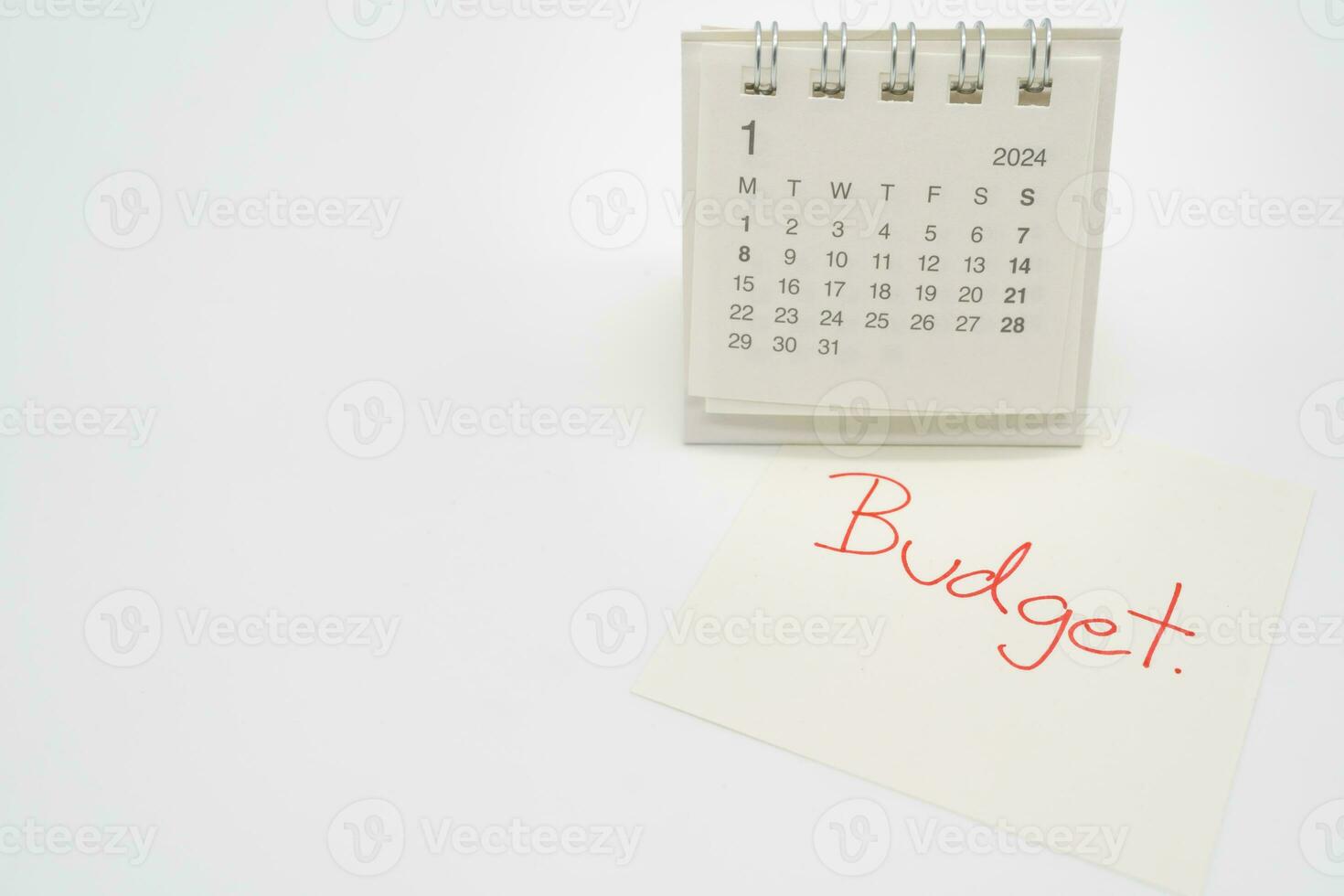 BUDGET text on paper with 2024 JAN calendar on a white background. Finance, money management concept. photo