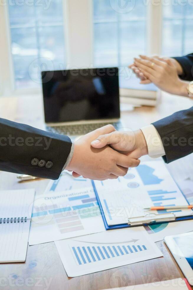 Businessmen and investors join hands symbolize friendship and cooperation in business success. concepts of group of businessmen and investors joining hands symbolize cooperation in doing business. photo