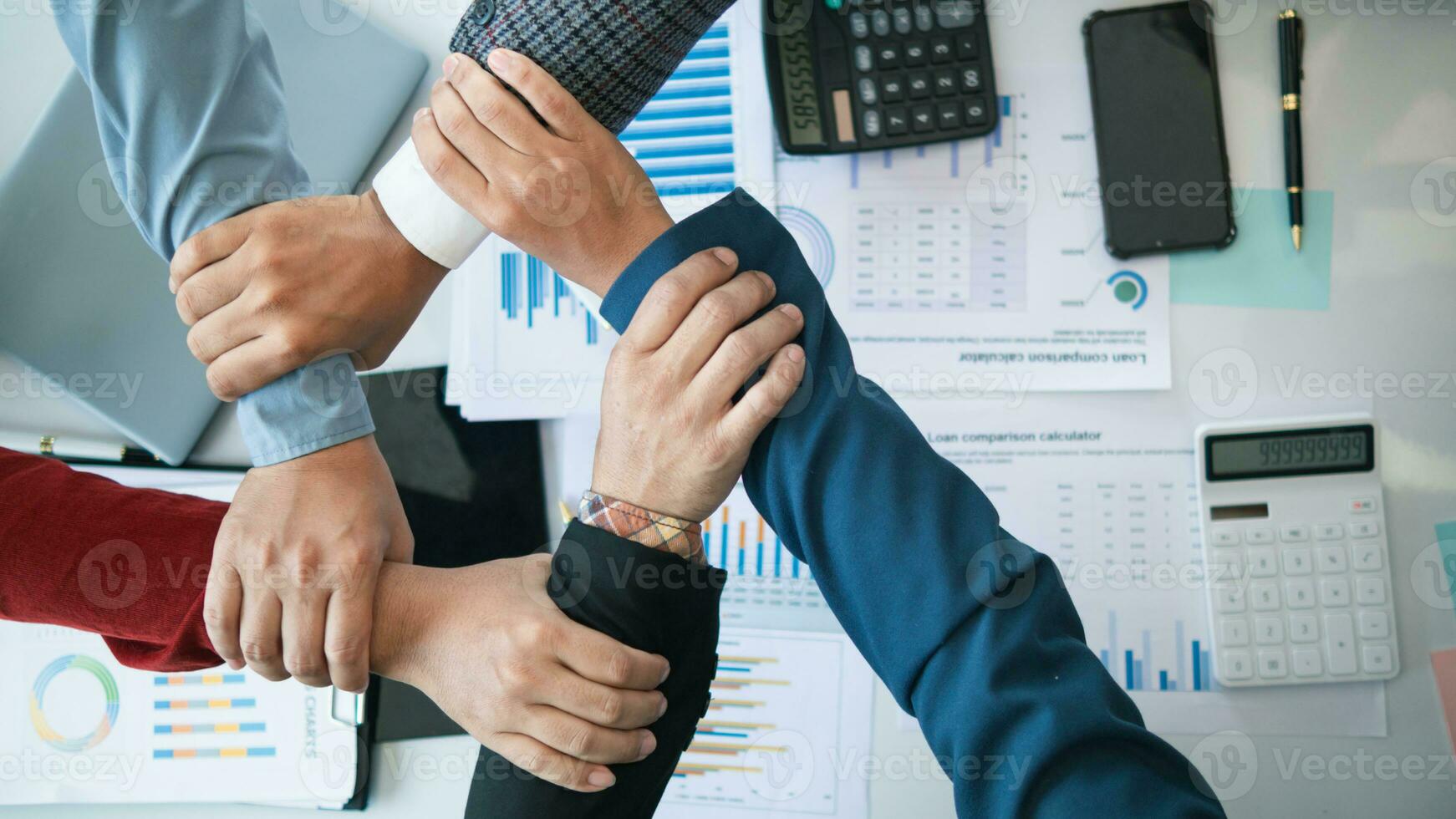 Businessmen and investors join hands symbolize friendship and cooperation in business success. concepts of group of businessmen and investors joining hands symbolize cooperation in doing business. photo