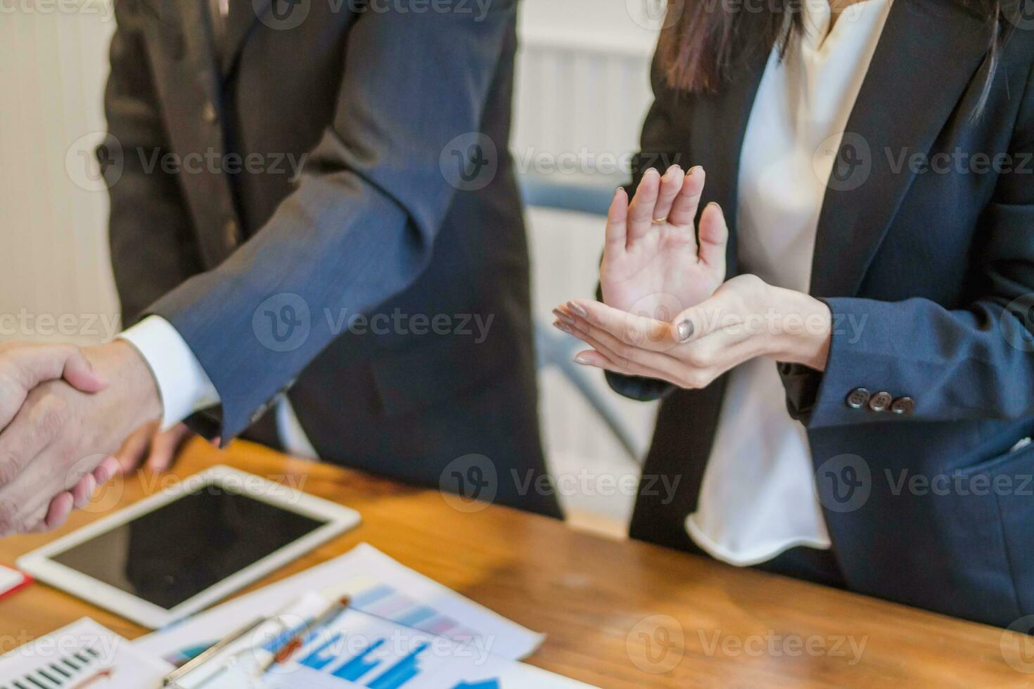 Businessmen and investors join hands symbolize friendship and cooperation in business success. concepts of group of businessmen and investors joining hands symbolize cooperation in doing business. photo