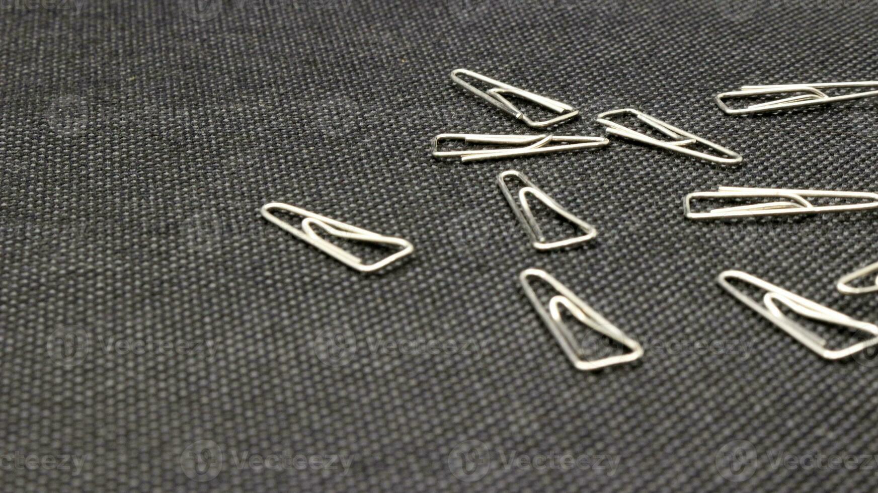 Close up of paper clips scattered photo