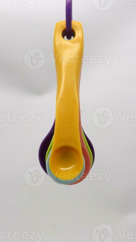 Measuring spoons in various colors photo