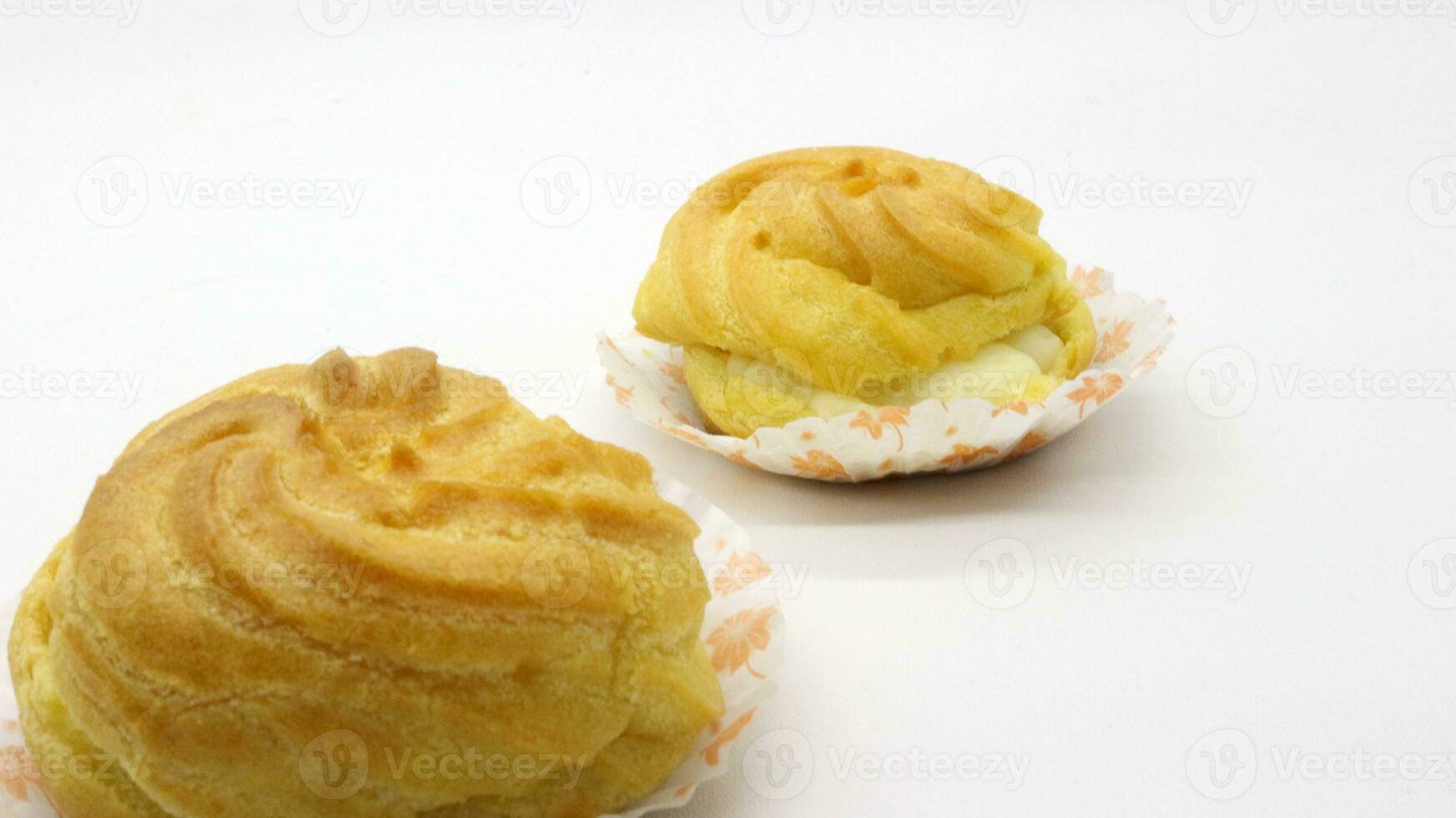Two traditional cake Cream puffs photo