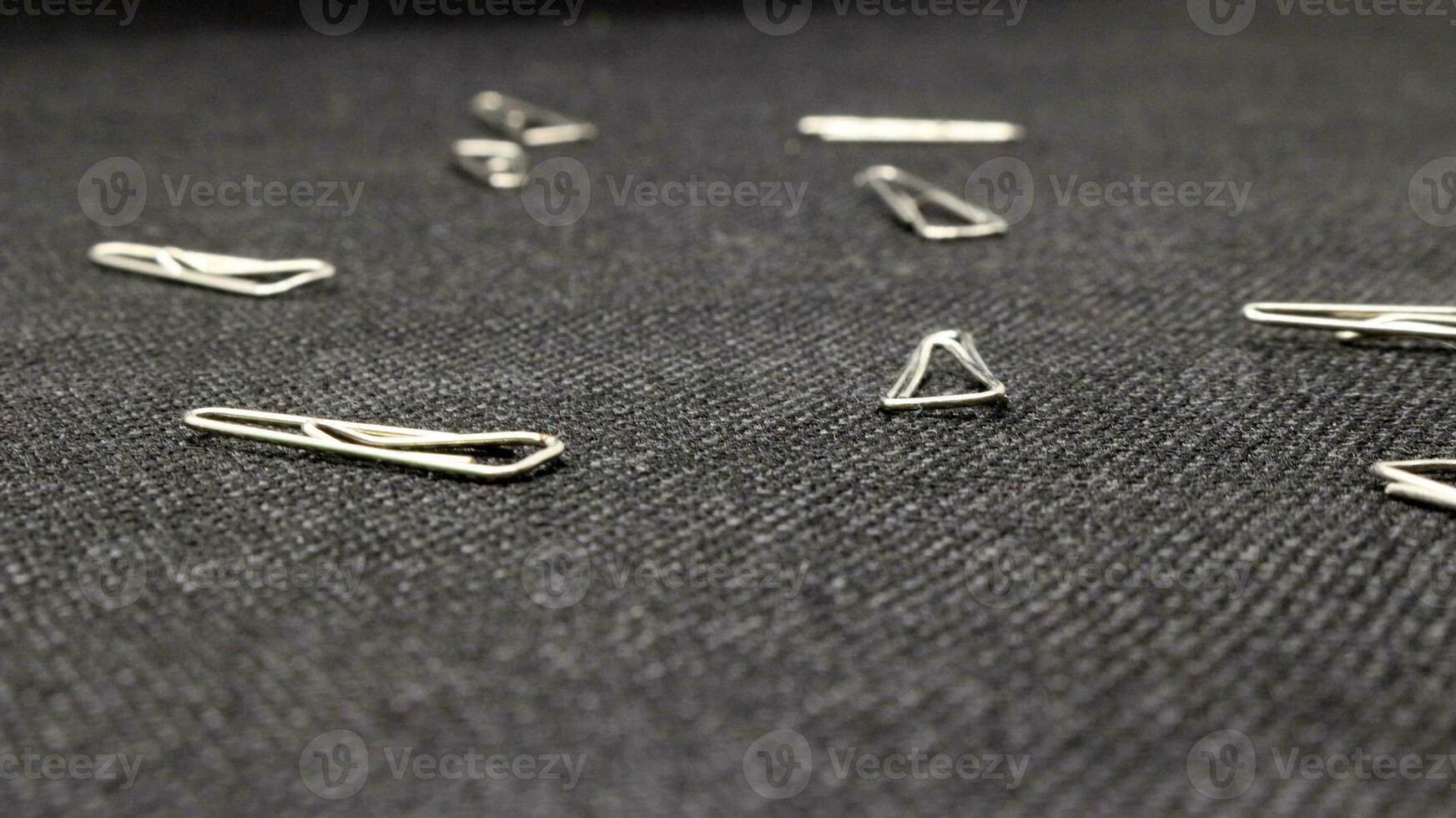 Close up of paper clips scattered photo