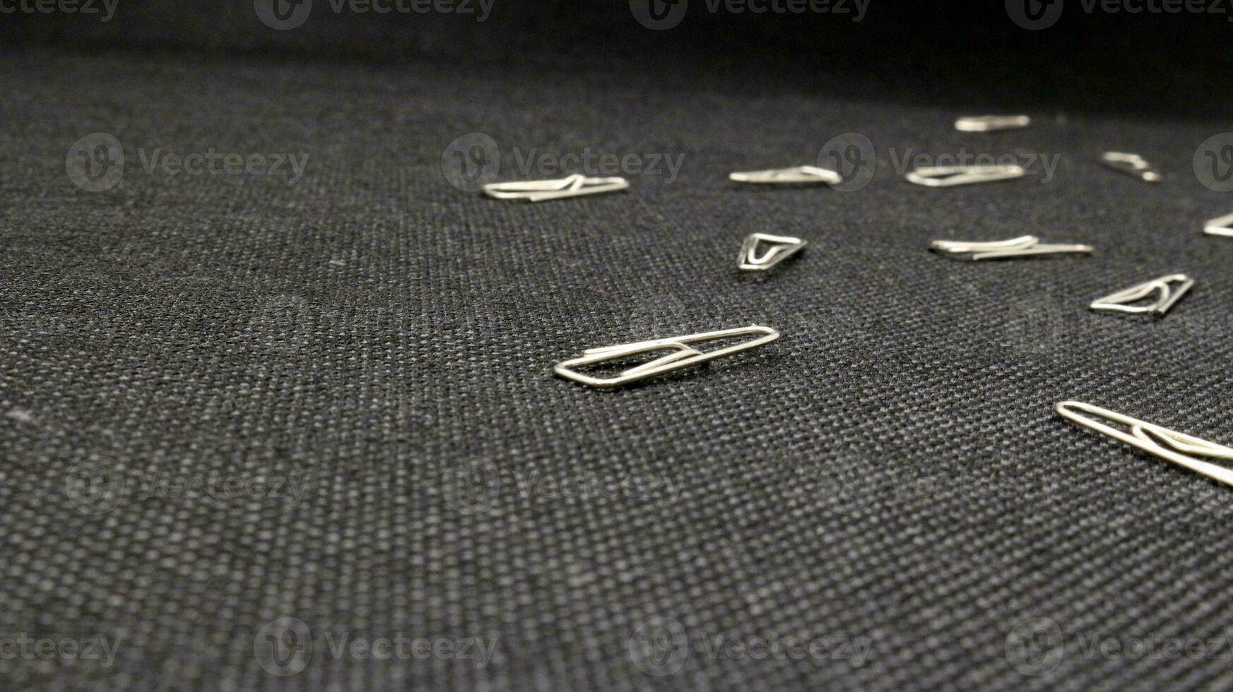 Close up of paper clips scattered photo