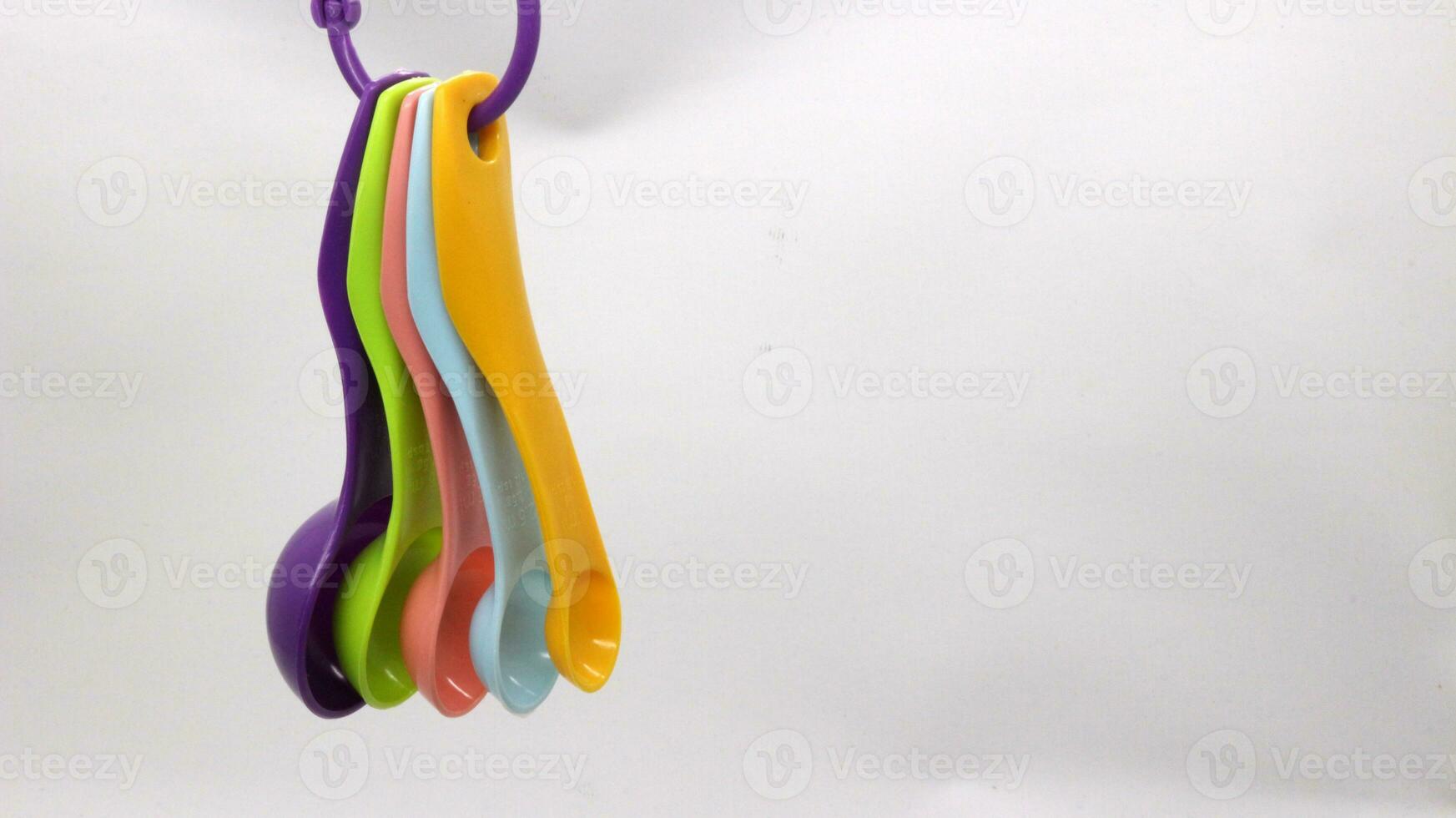 Measuring spoons in various colors photo