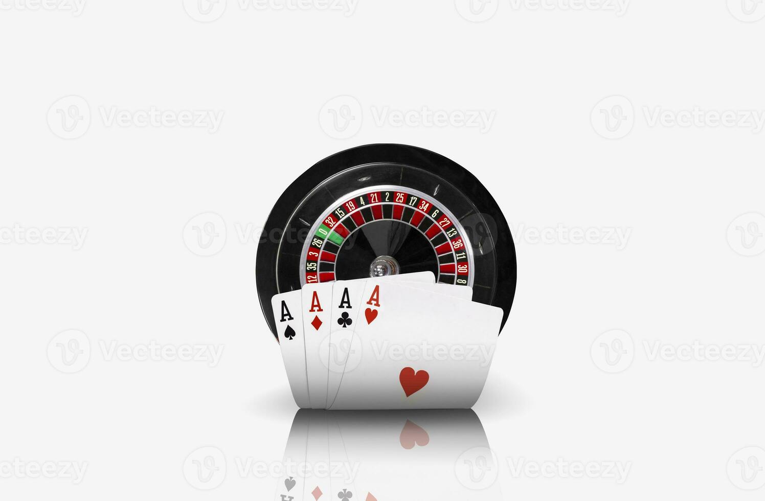 Close-up photo of four aces standing ahead of a black roulette, isolated on white background. Playing cards. Gambling entertainment.