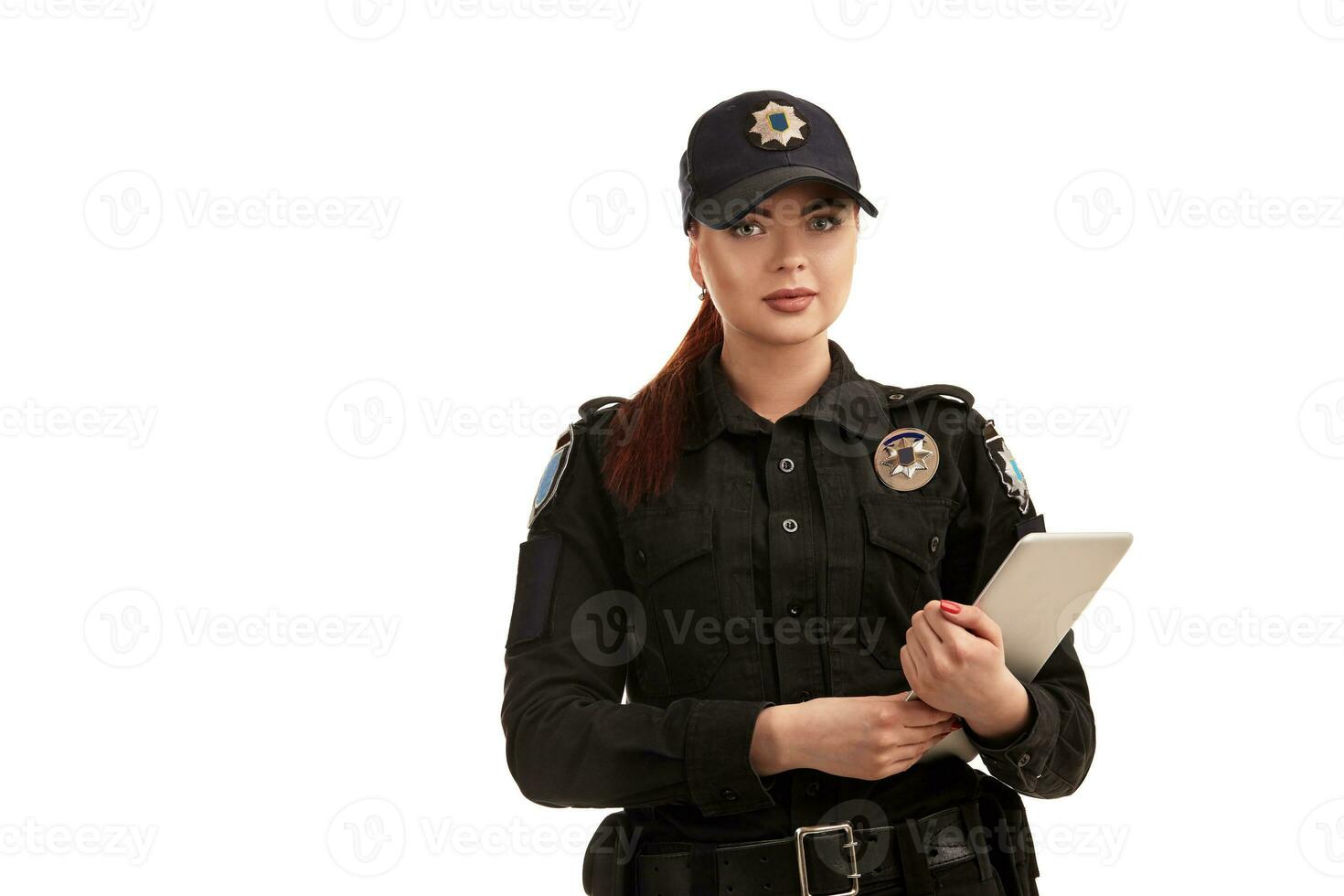 Close-up portrait of a female police officer is posing for the camera isolated on white background. photo