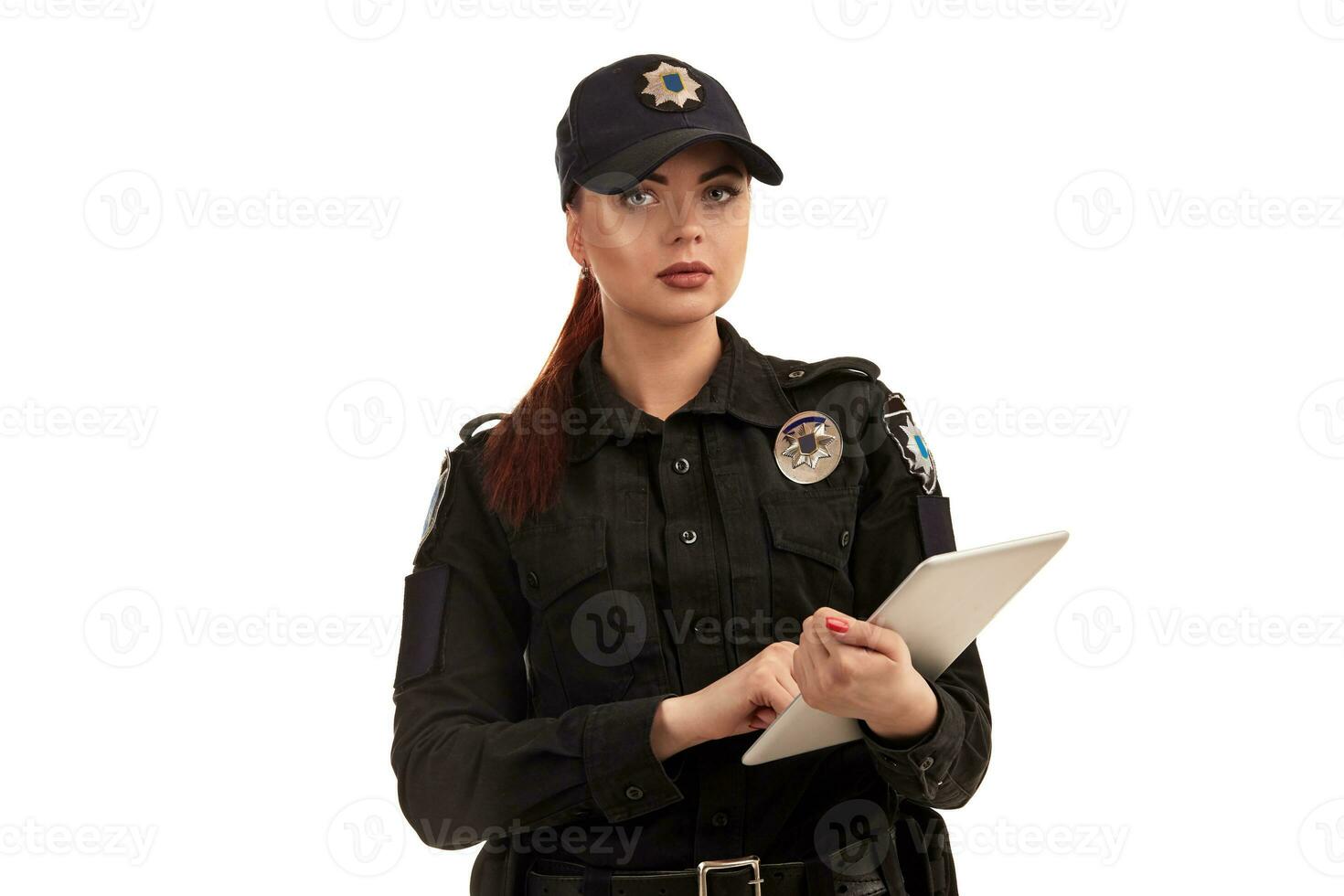 Close-up portrait of a female police officer is posing for the camera isolated on white background. photo