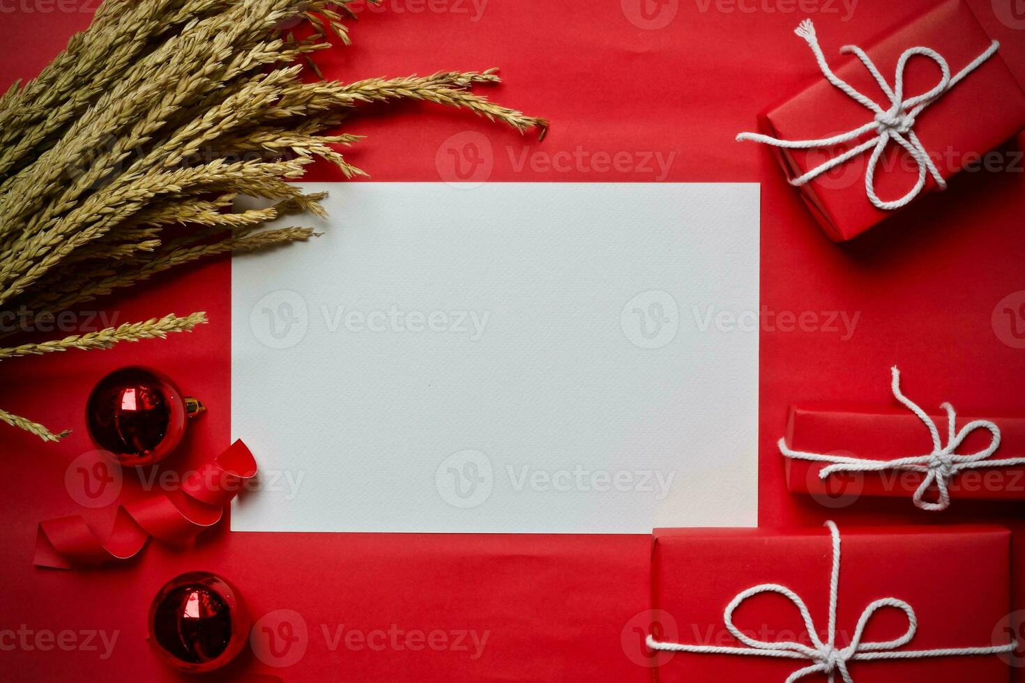 Christmas gift box composition on a red background. Flat lay top view copy space photo