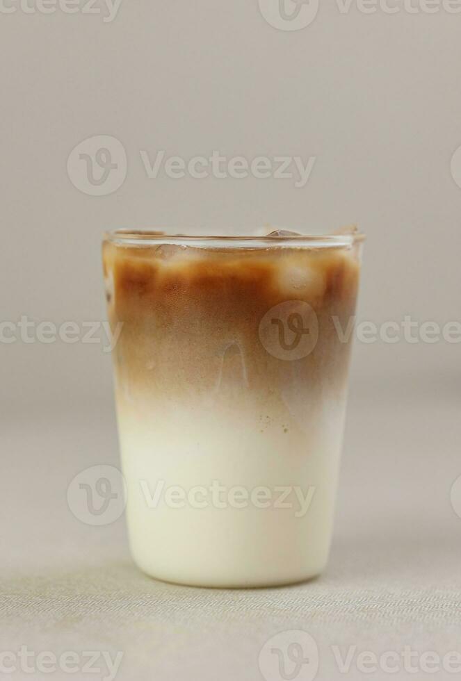 Iced Coffee Latte on Cream Background photo