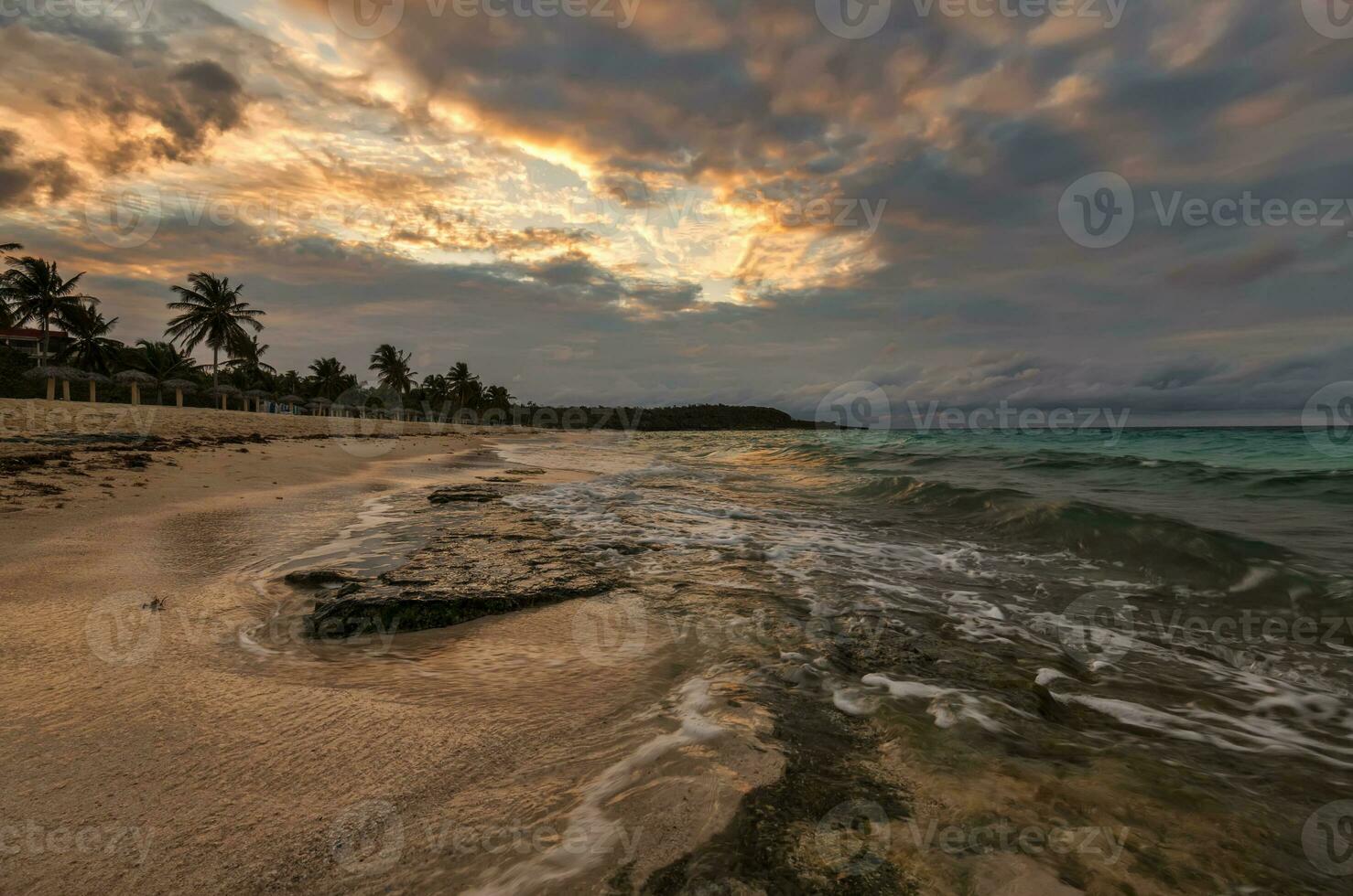 An incredible feeling at the shore of the Atlantic ocean in anticipation of sunset, Cuba photo