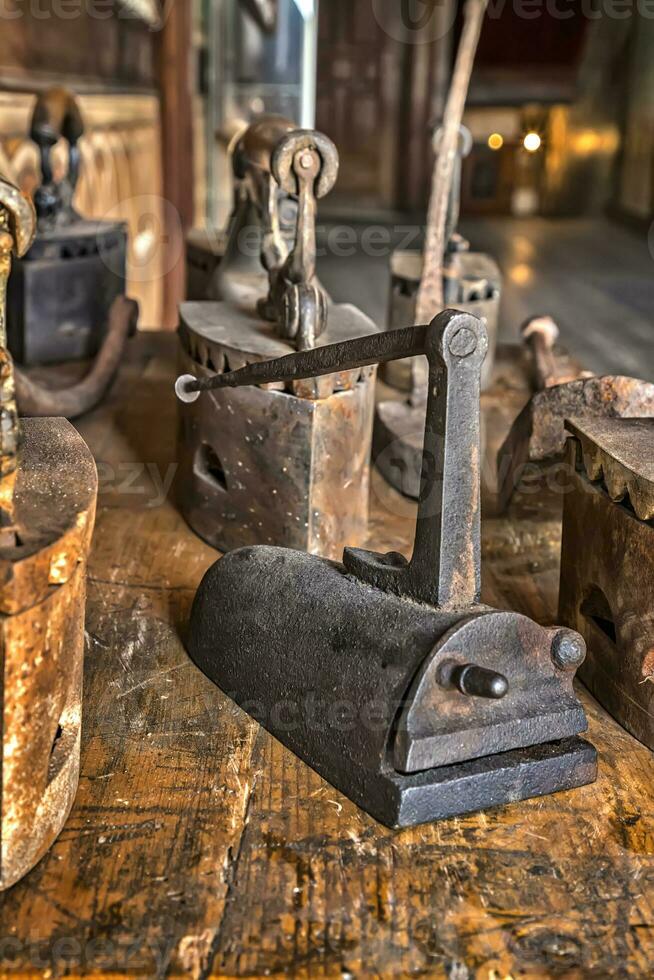 Ancient vintage irons for the clothes ironing photo