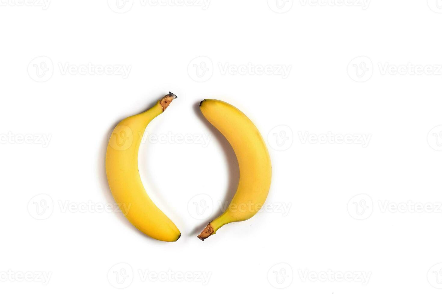 Ripe yellow bananas on a white background photo