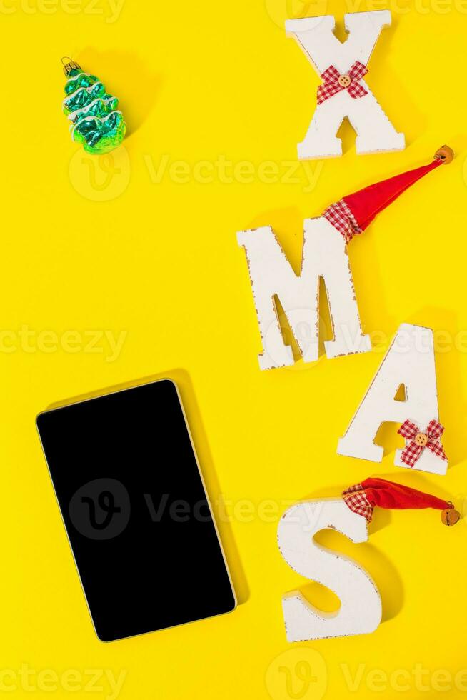 Smartphone with Christmas decorations. photo