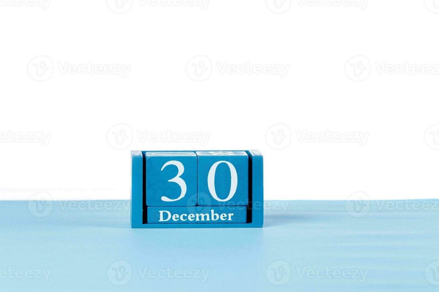 de madera calendario diciembre 30 en un blanco antecedentes foto