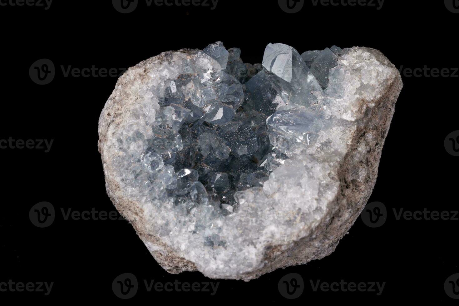 Celestine mineral stone macro on microcline on black background photo