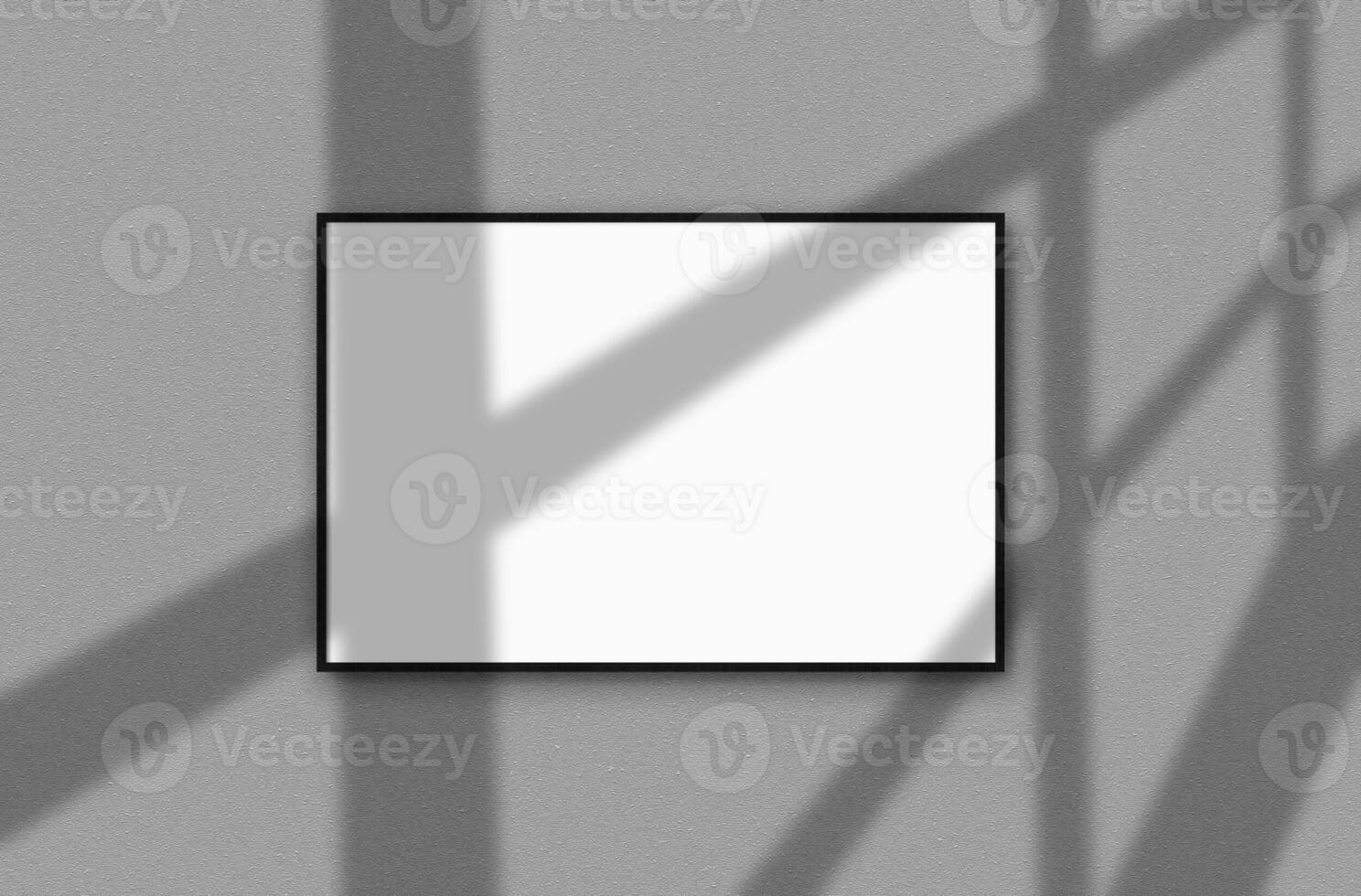 One big, white blank banner for your text or images hanging on a gray wall with shadows from the window on it. Mockup. Close-up. photo