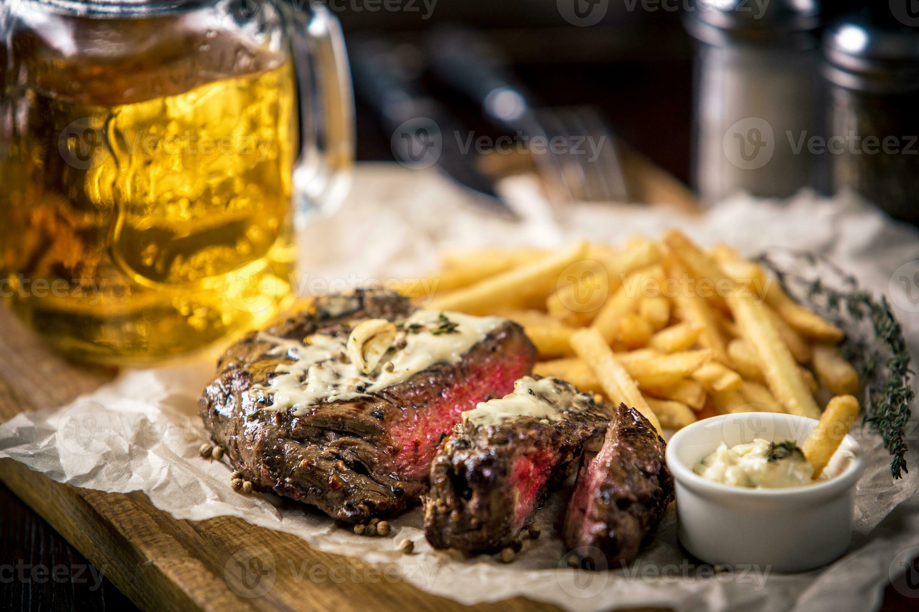 Healthy lean grilled mediumrare steak with french fries, beer 34939284 Stock Photo at Vecteezy