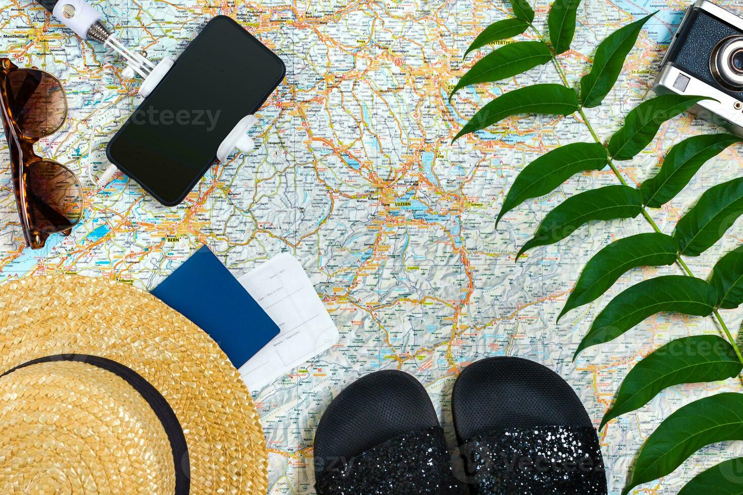 Travel plan, trip vacation accessories for trip, tourism mockup - Outfit of traveler on map background. Flat lay and copyspace. photo