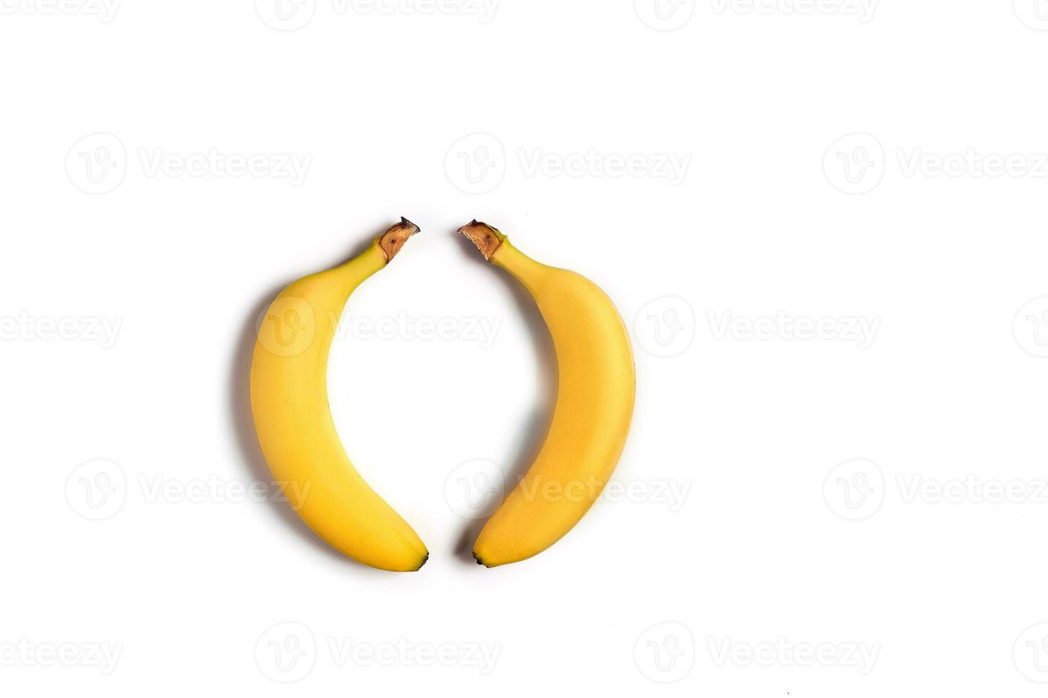 Ripe yellow bananas on a white background photo