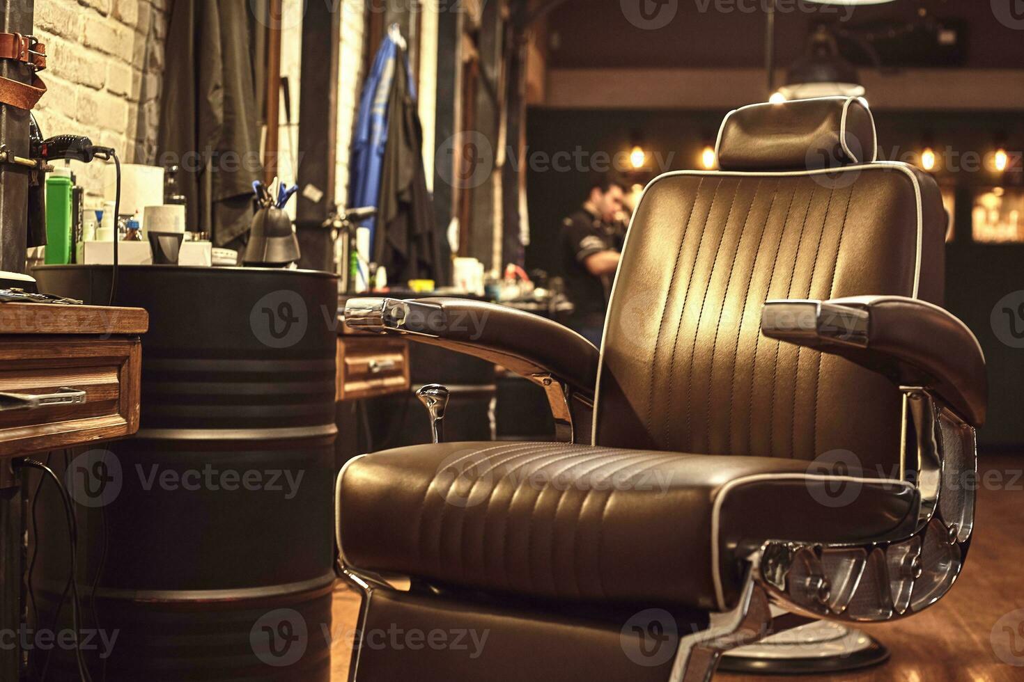 Brown leather chair in barbershop. Loft style photo