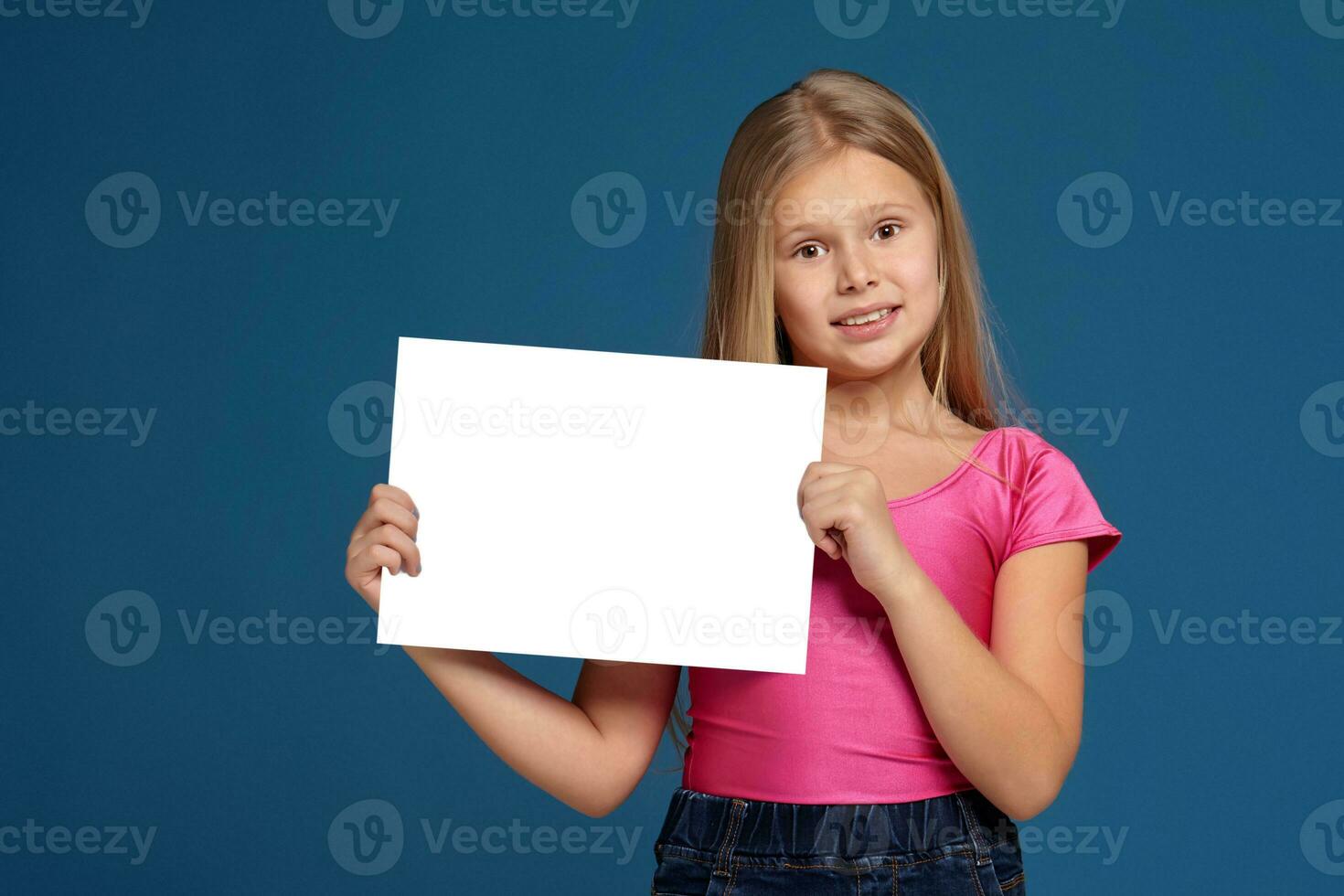 Portrait of adorable emotional little girl on blue background photo