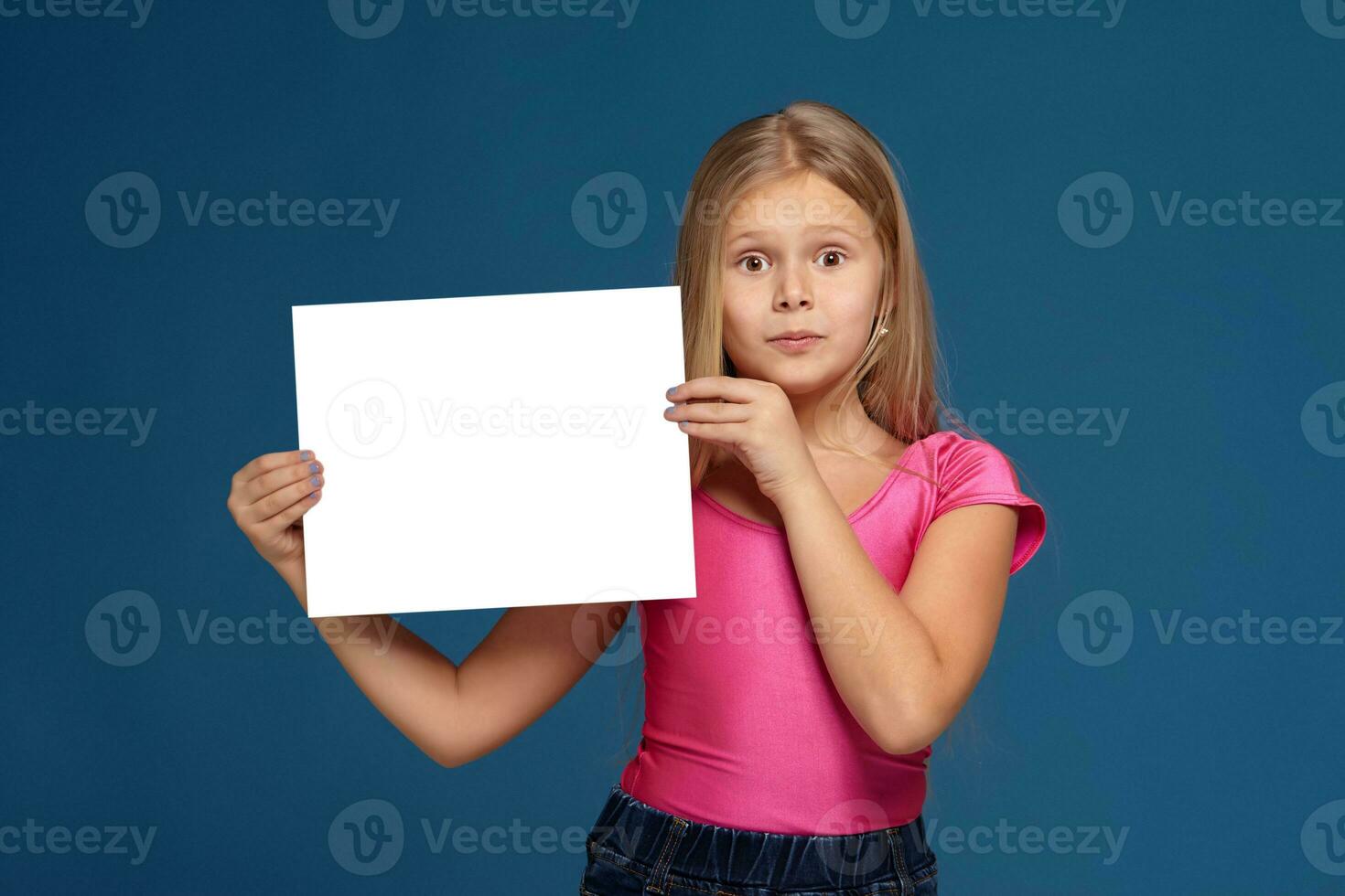 Portrait of adorable emotional little girl on blue background photo