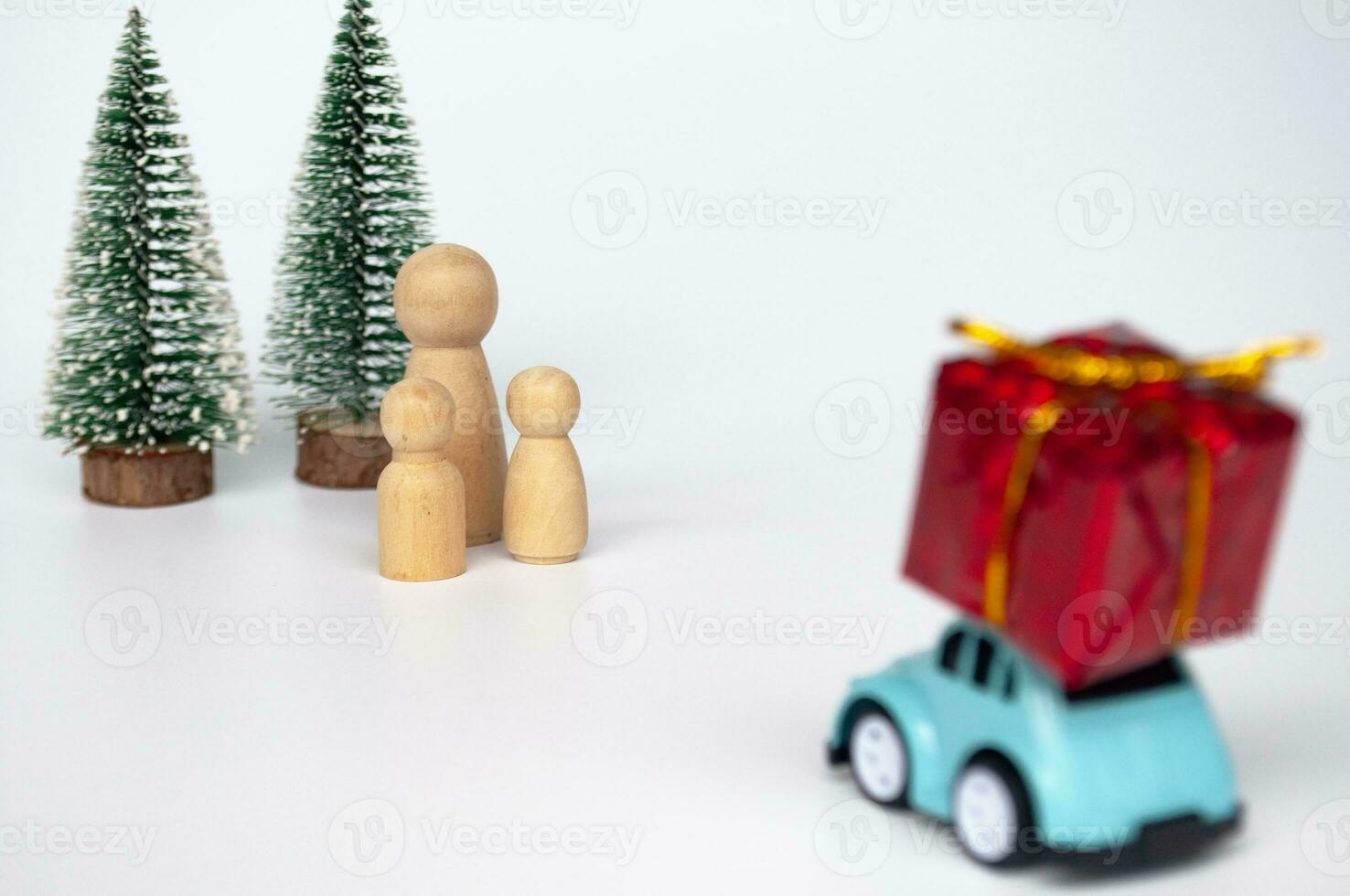 Toy car carry present while on a journey back home for Christmas. Christmas and holiday concept photo