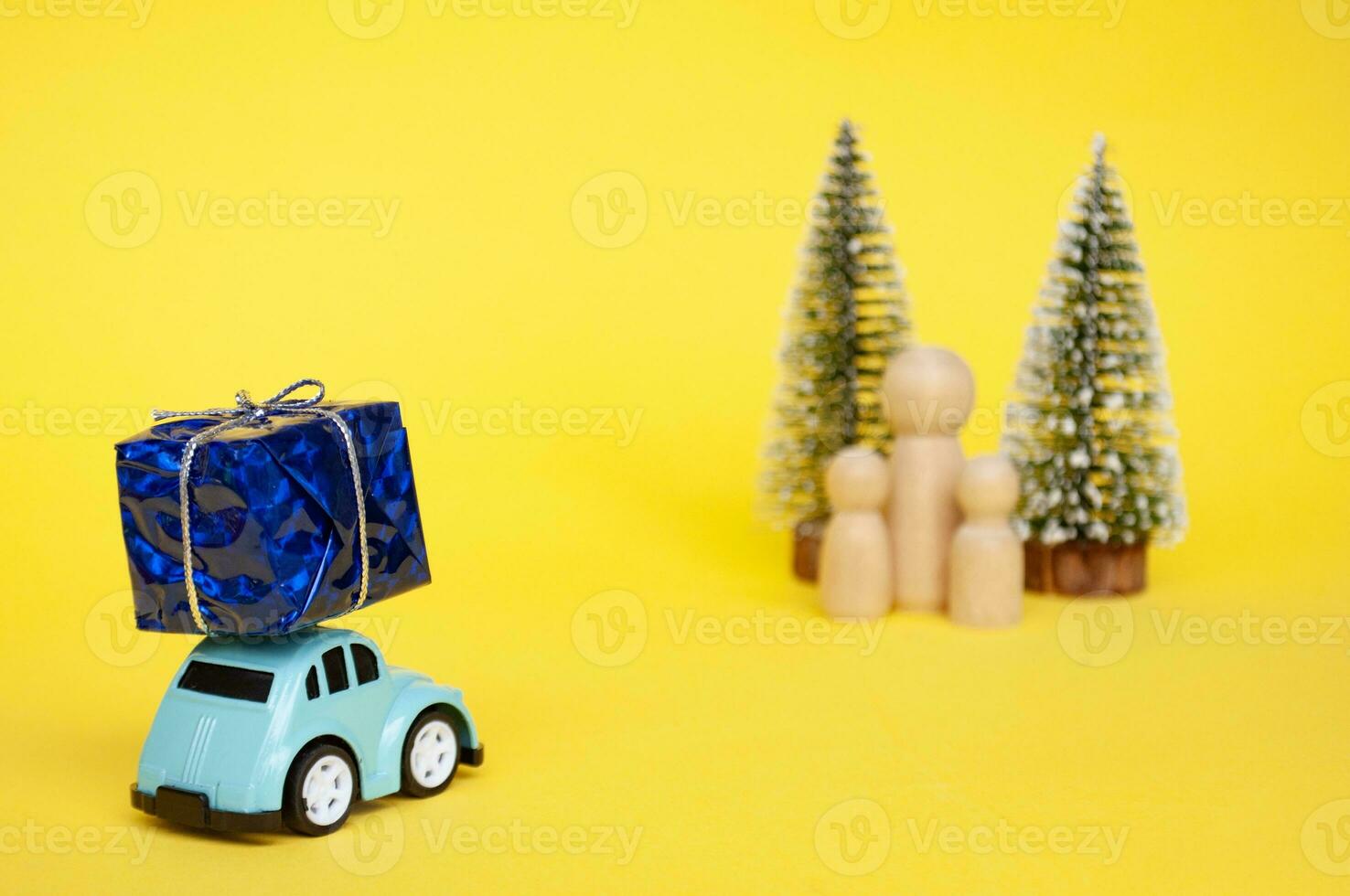 Mother, daughter, and son eagerly await their father return for Christmas with present photo