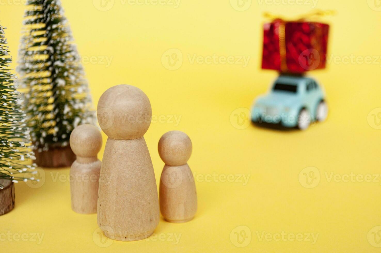 Mother, daughter, and son eagerly await their father return for Christmas with present photo