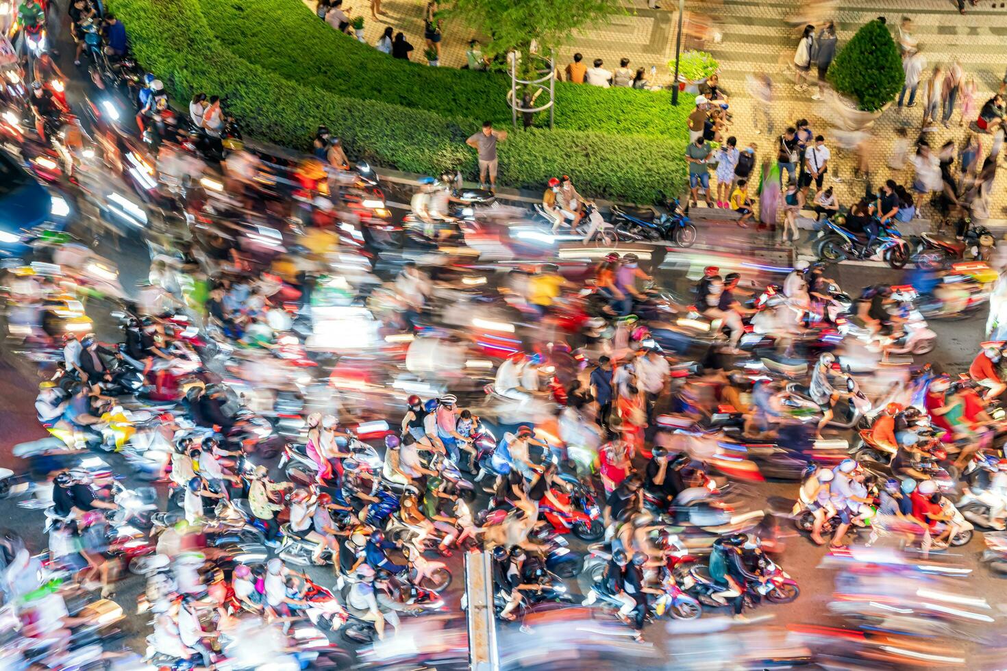 Ho Chi Minh city, Vietnam - Sep 2, 2023 View of Me Linh roundabout with heavy traffic near Bach Dang waterbus station port and Saigon river at blue hour photo