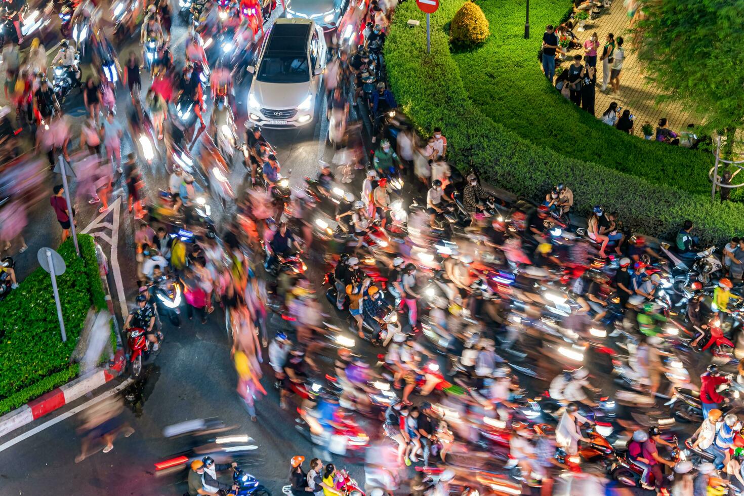 Ho Chi Minh city, Vietnam - Sep 2, 2023 View of Me Linh roundabout with heavy traffic near Bach Dang waterbus station port and Saigon river at blue hour photo