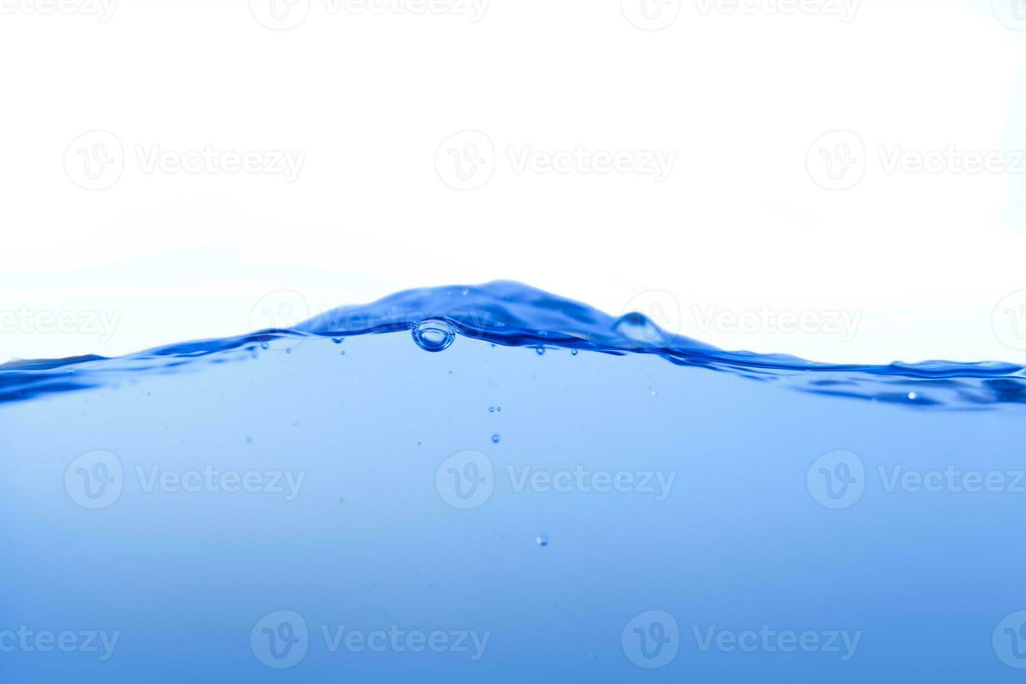 Blue water surface with splashes and bubbles on white background. photo