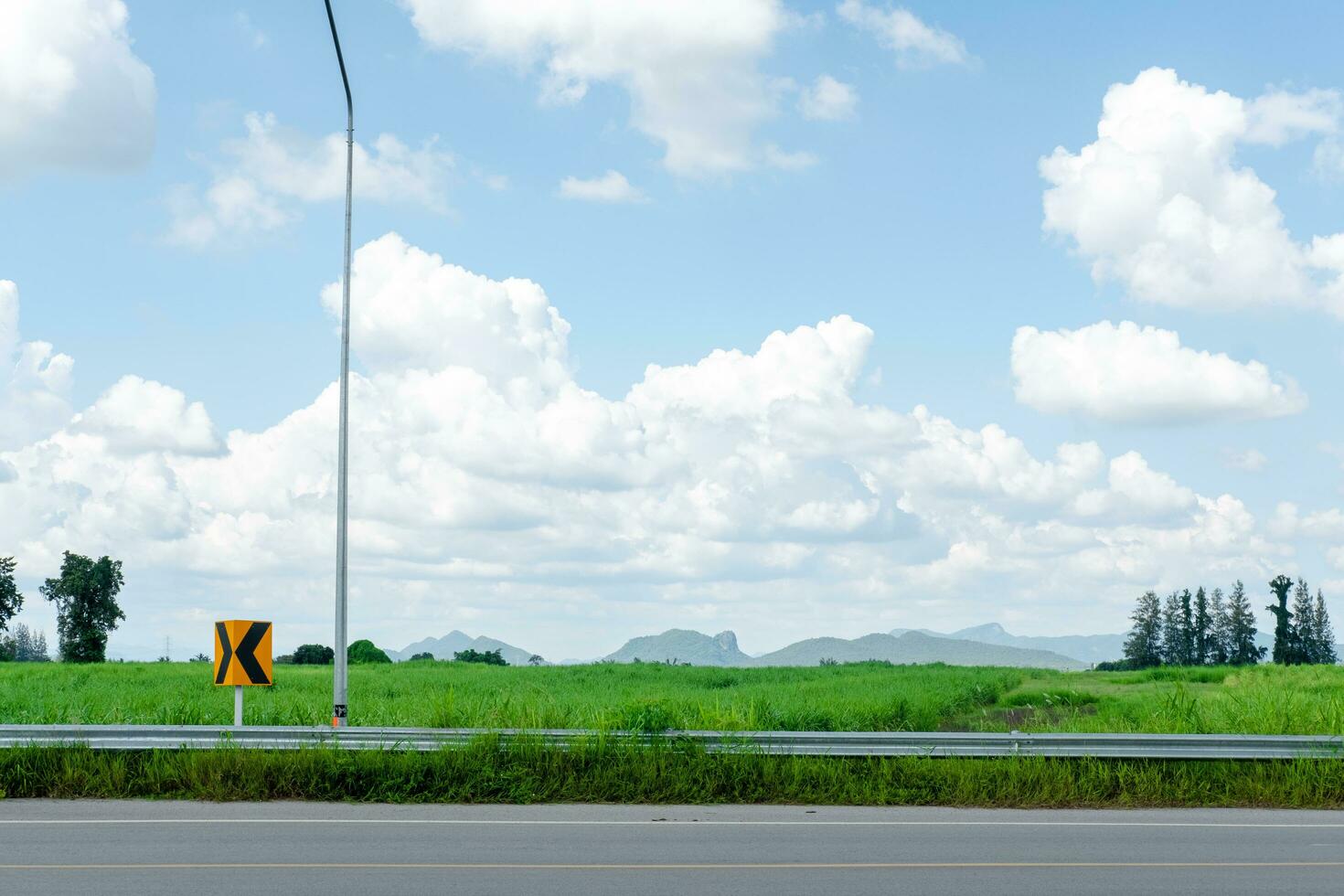 Beautiful views of flowers, mountains, and sky beside the road. Travel and leisure concept photo