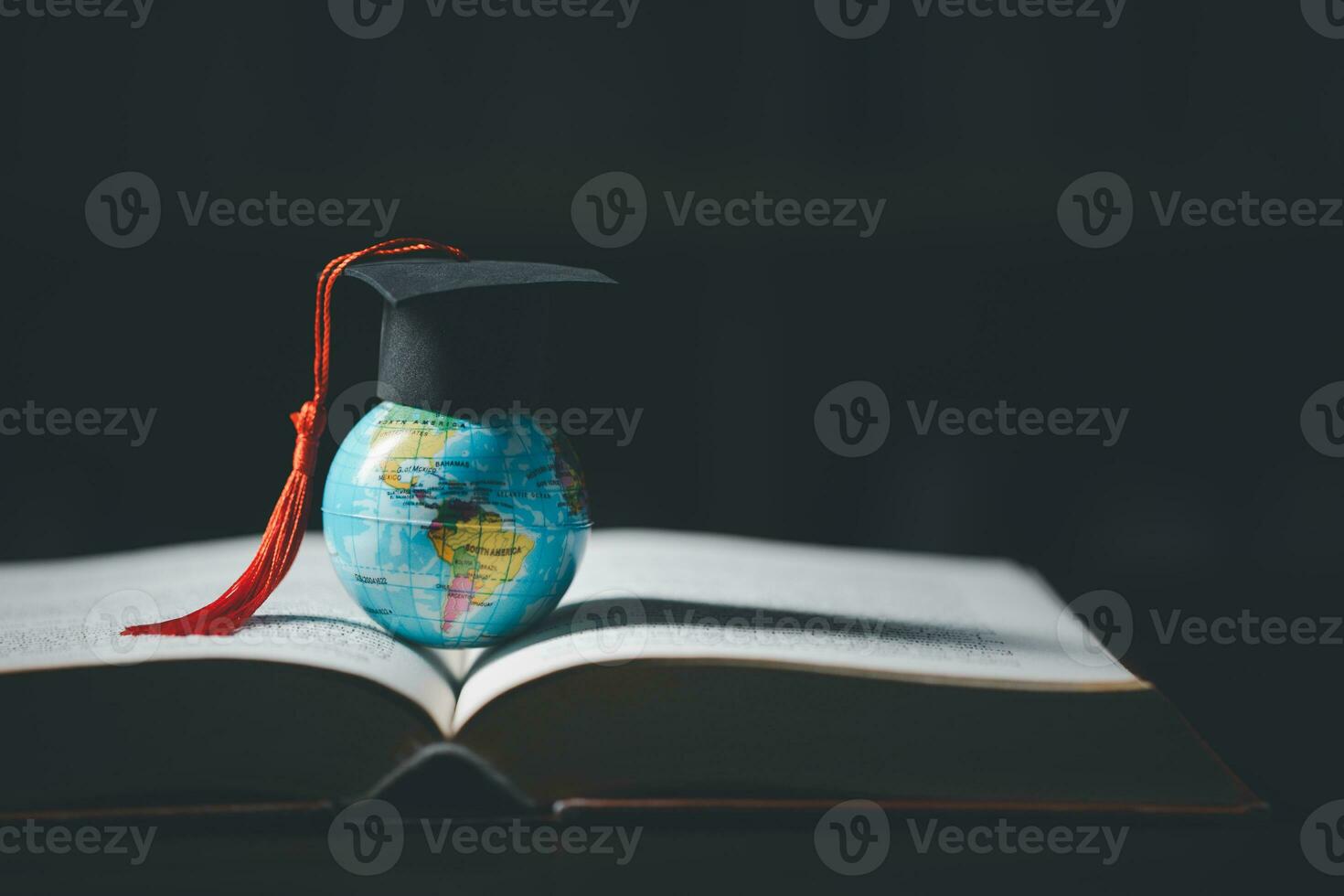 Graduated study abroad international Conceptual, Graduation hat on top Earth globe model map.Congratulations to graduates, Studies lead to success in world wide.Back to School. credited world by NASA photo