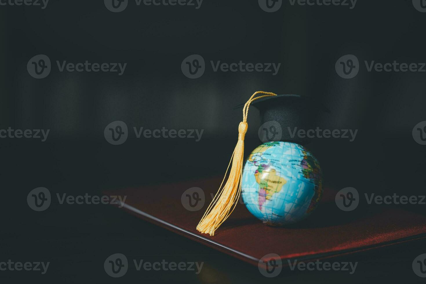 Graduated study abroad international Conceptual, Graduation hat on top Earth globe model map.Congratulations to graduates, Studies lead to success in world wide.Back to School. credited world by NASA photo