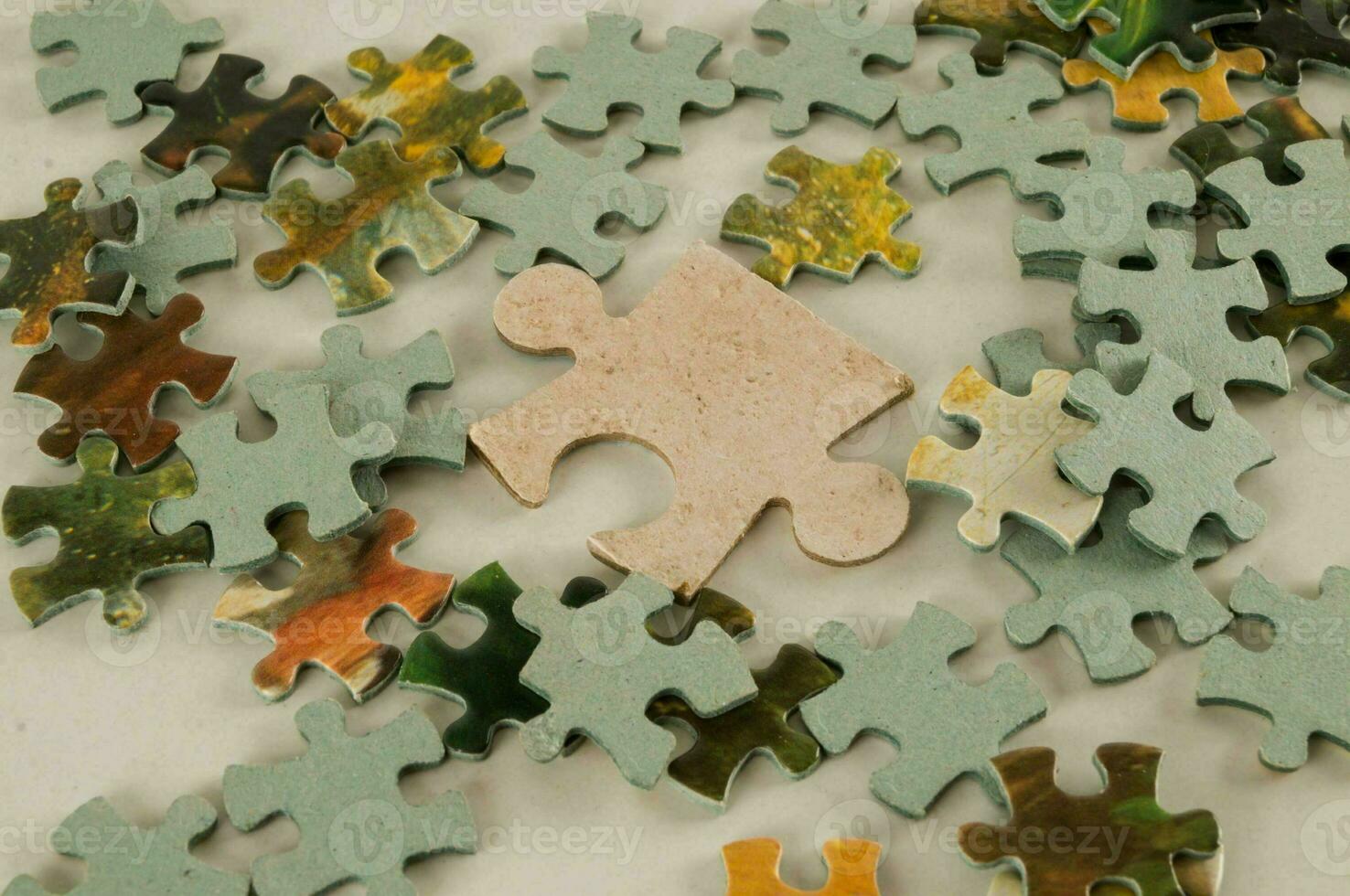 a white background with a puzzle piece on it photo