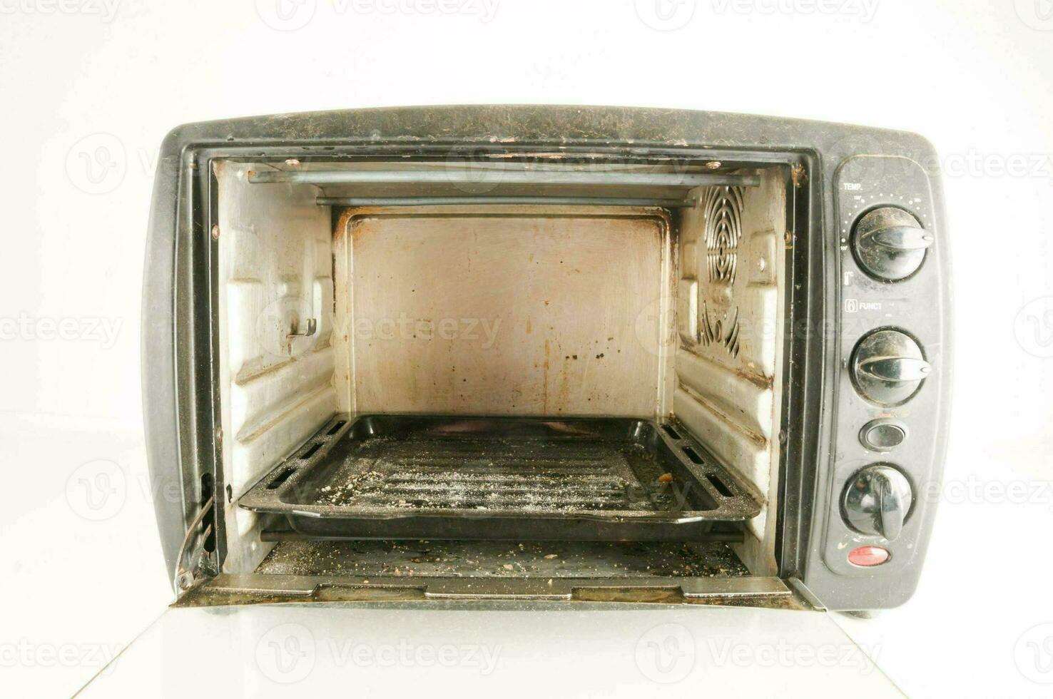 an old toaster oven with a dirty interior photo