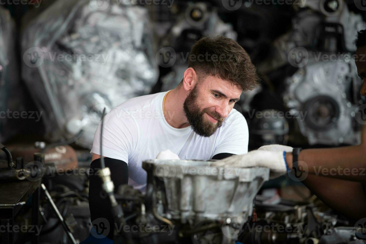 Men repairing car engine in auto repair shop, Selective focus. photo