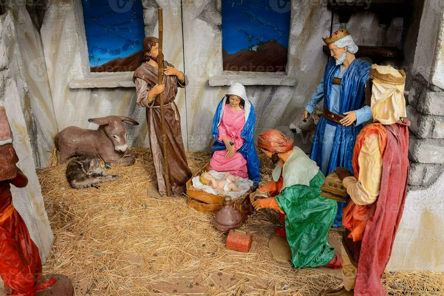 a nativity scene with a manger, a manger, and a sheep photo