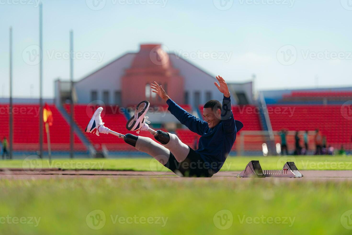Athletes with disabilities take a break at the stadium between training sessions. photo