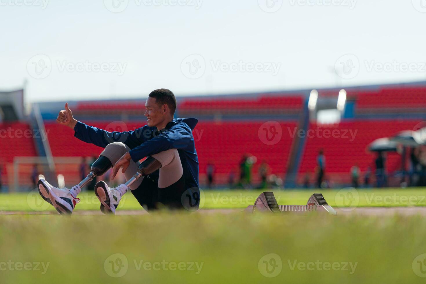 Athletes with disabilities take a break at the stadium between training sessions. photo